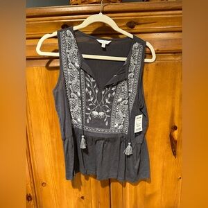 Cute lucky top size smallll with tassel and NWT
